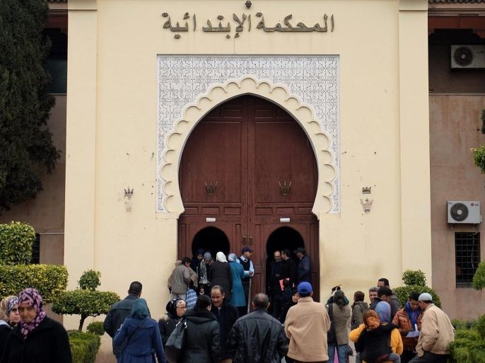 A general views shows people walking outside the court in Marrakesh on January 29, 2015 where a hearing is taking place in the trial of French national Jean-Luc G who has been accused of abusing nine children. Jean-Luc G was sentence to two years in prison. AFP PHOTO / FADEL SENNA