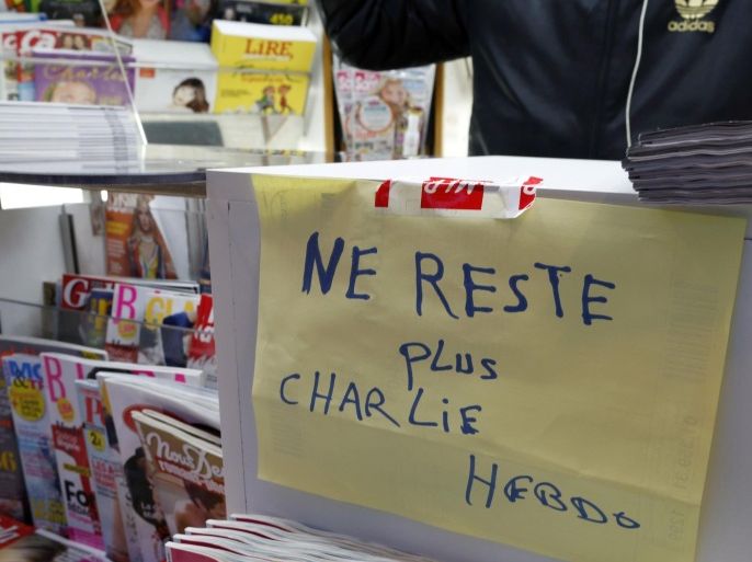 A handwritten sign at a newsstand, which reads "No more Charlie Hebdo", is displayed after it sold out the limited stock of the satirical newspaper in Paris January 14, 2015. Charlie Hebdo published a front page showing a caricature of the Prophet Mohammad in its first edition since Islamist gunmen attacked it. With demand surging for the edition due on Wednesday, the weekly planned to print up to 3 million copies, dwarfing its usual run of 60,000, after newsagents reported a rush of orders. REUTERS/John Schults   (FRANCE - Tags: CRIME LAW MEDIA)