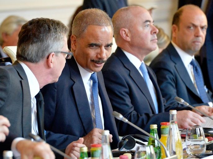 PARIS, FRANCE - JANUARY 11: German Minister of Interior Thomas de Maiziere (R) and Eric Holder (L) , Minister of Interior of the United States of A;erica during the meeting with ministers of interior and homeland security held in the ministry of interior Place Beauvau on January 11, 2015 in Paris, France. The meeting is organised prior a lunch at Palais de l' Elysee and they will all join the mass unity rally held in Paris following the recent terrorist attacks