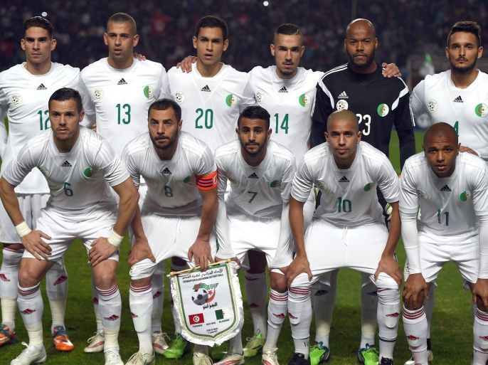 The Algerian football team (TOP from the left to right) Carl Medjani, Islam Slimani, Aissa Mandi, Nabil Bentaleb, Rais Mbolhi and Liassine Cadamuro , (BOTTOM from left To right) Djameleddine Mesbah, Mehdi Lacen, Riadh Mahrez, Sofiene Feghouli and Yassine Brahimi pose for a picture during a friendly soccer match between Tunisia and Algeria on January 11, 2015 at Rades Olympic Stadium in Tunis. AFP PHOTO/ FETHI BELAID