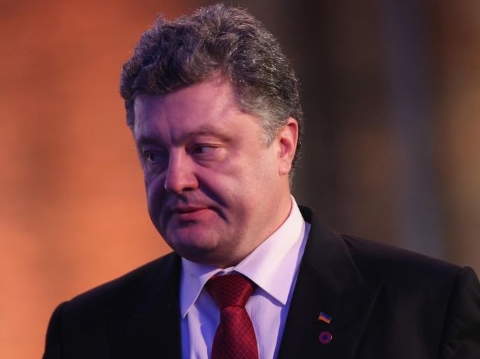 OSWIECIM, POLAND - JANUARY 27: Ukrainian President Petro Poroshenko attends ceremonies marking the 70th anniversary of the liberation of Auschwitz at the former Auschwitz-Birkenau concentration camp on January 27, 2015 in Oswiecim, Poland. International heads of state, dignitaries and over 300 Auschwitz survivors are attending the commemorations for the 70th anniversary of the liberation of Auschwitz by Soviet troops on 27th January, 1945. Auschwitz was among the most notorious of the concentration camps run by the Nazis during WWII and whilst it is impossible to put an exact figure on the death toll it is alleged that over a million people lost their lives in the camp, the majority of whom were Jewish.