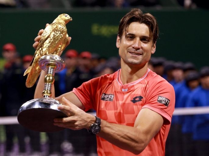 David Ferrer of Spain poses with his trophy after beating Czech tennis player Tomas Berdych in the final match of the Qatar ExxonMobil ATP Open Tennis tournament at the Khalifa Tennis Complex in Doha, Qatar, 10 January 2015.