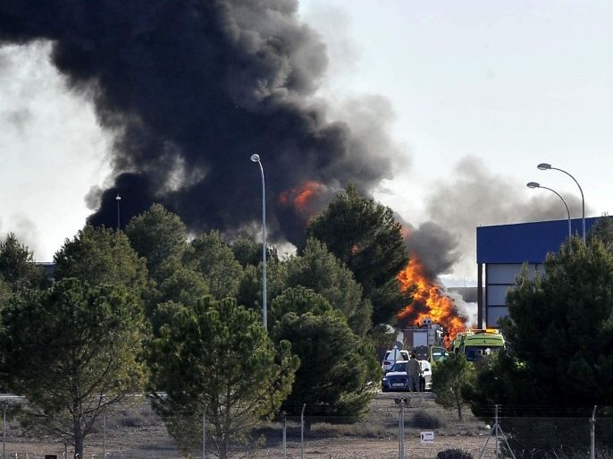 Smoke rises after a Greek F-16 aircraft crashed at Los Llanos air base in Albacete, eastern Spain, 26 January 2015. The two pilots have been reported dead and other 10 people have been injured following the accident. The plane was taking part in the NATO's Tactical Leadership Programme (TLP) based at Los Llanos.