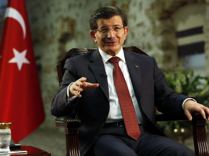 Turkey's Prime Minister Ahmet Davutoglu speaks during an interview with Reuters in Istanbul January 16, 2015. Davutoglu said on Friday the Syrian city of Aleppo must be protected from bombardment by President Bashar al-Assad's forces before Turkey would consider stepping up its role in the U.S.-led coalition against Islamic State. REUTERS/Murad Sezer (TURKEY - Tags: POLITICS)
