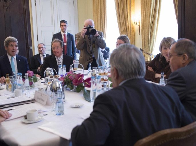 US Secretary of State John Kerry (L) talks during a meeting with Russian Foreign Minister Sergei Lavrov (R) and other members of the the Quartet on the Middle East on the third day of the 51st Munich Security Conference (MSC) in Munich, southern Germany, on February 8, 2015. The Ukraine conflict, Islamic State group jihadists and the wider 'collapse of the global order' occupy the world's security community at the annual meeting. Also on the agenda of the three-day Conference are Iran's nuclear talks, the Syrian war and mass refugee crisis, West Africa's Ebola outbreak and cyber terrorism. AFP PHOTO / POOL / JIM WATSON