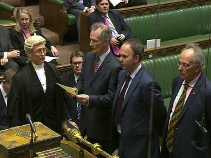 In this screen shot from Parliament, the results of the vote is returned in the debating chamber at the House of Commons, in London, Tuesday Feb. 3, 2015. British lawmakers in the House of Commons voted Tuesday to allow scientists to create babies from the DNA of three people _ a move that could prevent some children from inheriting potentially fatal diseases from their mothers. The bill must next be approved by the House of Lords before becoming law. If so, it would make Britain the first country in the world to allow embryos to be genetically modified. (AP Photo/Parliament, PA) UNITED KINGDOM OUT