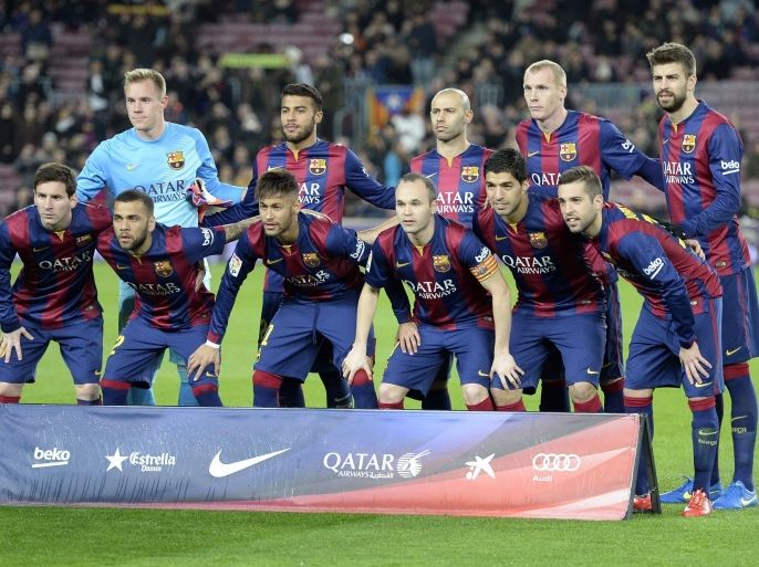 Barcelona's players pose for photographers before the Spanish Copa del Rey (King's Cup) semifinal first leg football match FC Barcelona vs Villarreal CF at the Camp Nou stadium in Barcelona on February 11, 2015. AFP PHOTO / LLUIS GENE