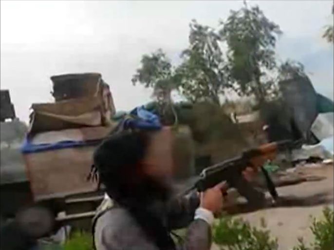 تسجيل مصور يظهر مهاجمة مسلحي تنظيم الدولة مقرين للجيـش والميليشيات جنوب غربـي بغداد