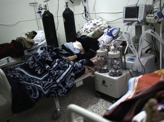In this Tuesday, Dec. 18, 2012 photo, Syrian patients lie in their beds at an intensive care unit of a hospital in the village of Atmeh, Syria.