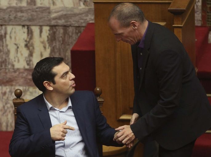 Greece's new leftist finance minister Yanis Varoufakis (R) talks with Greek Prime Minister Alexis Tsipras in the parliament in Athens, February 6, 2015. Varoufakis clashed openly with his powerful German counterpart on Thursday as Athens' borrowing costs leapt and bank shares plunged following the European Central Bank's decision to stop funding the country's lenders. REUTERS/Panayiotis Tzamaros/FOSPHOTOS (GREECE - Tags: POLITICS BUSINESS)