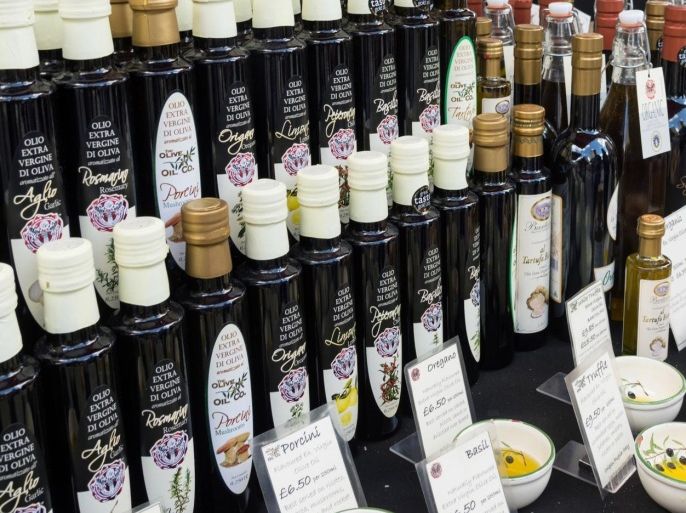 Italian extra virgin olive oil on stall at Broadway Market, Hackney, London, UK