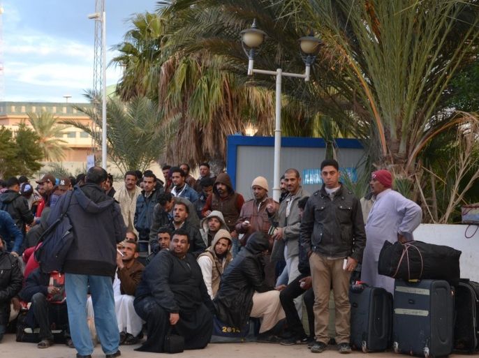BEN GARDANE, TUNISIA - FEBRUARY 22: Egyptians waiting buses at Ras Ejdir border crossing point to go Djerba Airport for arriving Egypt due to security issues after Islamic State of Iraq and Levant (ISIL) militants beheaded 21 Egyptian Coptic Christians in Libya, on February 22, 2015 in Ben Gardane, Tunisia.