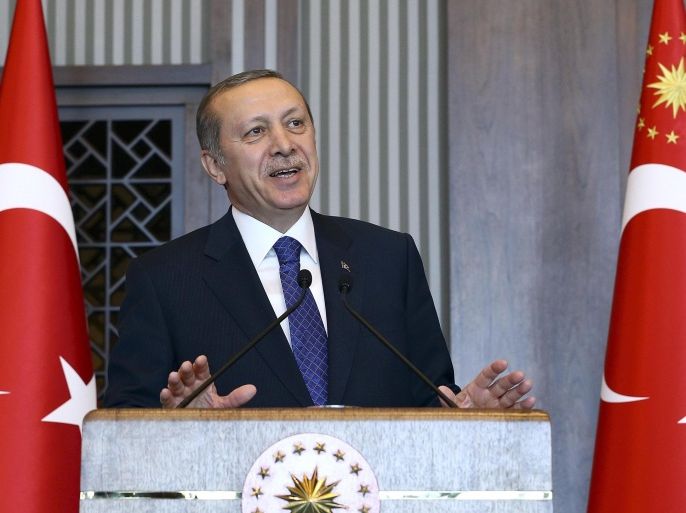 Turkey's Pesident Tayyip Erdogan addresses the provincial governors of Turkey during a meeting at the Presidential Palace in Ankara February 27, 2015. Turkish Central Bank Governor Erdem Basci sought to calm jittery investors on Friday, dismissing rumours that he would resign and giving a brief lift to the lira currency after it tumbled to a record low.Basci's future, and the independence of the central bank, have been a concern for investors since President Tayyip Erdogan stepped up criticism of the bank this week after it failed to meet his demand for bigger rate cuts. Speaking at a lunch for provincial governors on Friday, Erdogan did not mention the bank's latest rate decision but repeated his view that high interest rates amounted to a betrayal of the nation. REUTERS/Kayhan Ozer/Presidential Palace Press Office/Handout via Reuters (TURKEY - Tags: POLITICS) ATTENTION EDITORS - NO SALES. NO ARCHIVES. FOR EDITORIAL USE ONLY. NOT FOR SALE FOR MARKETING OR ADVERTISING CAMPAIGNS. THIS IMAGE HAS BEEN SUPPLIED BY A THIRD PARTY. IT IS DISTRIBUTED, EXACTLY AS RECEIVED BY REUTERS, AS A SERVICE TO CLIENTS