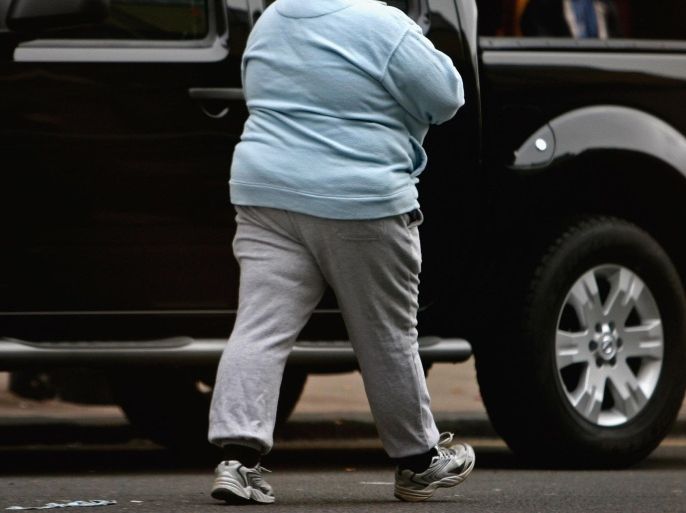 GLASGOW, UNITED KINGDOM - OCTOBER 10: An overweight person walks through Glasgow city centre on October 10, 2006 in Glasgow, Scotland. According to government health maps published today, people in the north of England lead less healthy lifestyles compared to those in the south. The United Kingdom is also the fattest country in Europe, according to a new study of obesity rates to be released today. The 'Health Profile of England' report, compiled from government data, said some 24 percent of people in England, Wales, Scotland and Northern Ireland are obese.