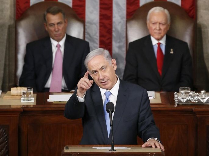 Israeli Prime Minister Benjamin Netanyahu gestures as he speaks before a joint meeting of Congress on Capitol Hill in Washington, Tuesday, March 3, 2015. In a speech that stirred political intrigue in two countries, Netanyahu told Congress that negotiations underway between Iran and the U.S. would "all but guarantee" that Tehran will get nuclear weapons, a step that the world must avoid at all costs. House Speaker John Boehner of Ohio, left, and Sen. Orrin Hatch, R-Utah, listen. (AP Photo/Andrew Harnik)