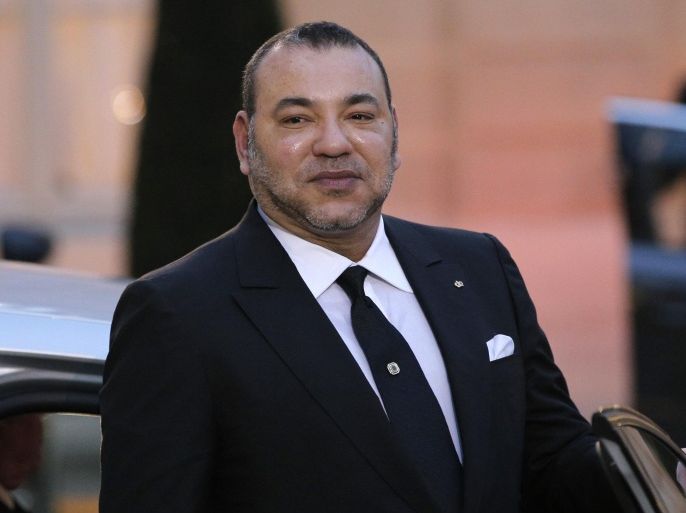 Morocco's King Mohammed VI poses as he leaves after a meeting with France's President Francois Hollande at the Elysee Palace, in Paris, France, Monday, Feb. 9, 2015. (AP Photo/Christophe Ena)