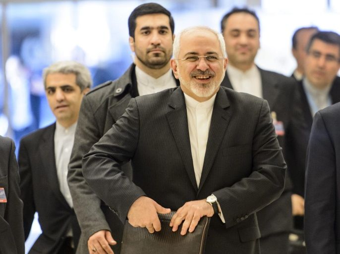 Iranian Foreign Minister Mohammad Javad Zarif, center, arrives for the 28th session of the Human Rights Council at the European headquarters of the United Nations in Geneva, Switzerland, Monday, March 2, 2015.