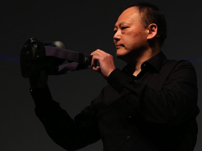 Peter Chou, chief executive officer of HTC Corp., unveils the View-A-Day virtual reality (VR) headset during a news conference ahead of the Mobile World Congress 2015 in Barcelona, Spain, on Sunday, Mar., 1, 2015. The event, which generates several hundred million euros in revenue for the city of Barcelona each year, also means the world for a week turns its attention back to Europe for the latest in technology, despite a lagging ecosystem.