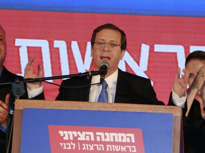 Co-leader of the Zionist Union party, Israeli Labour Party leader Isaac Herzog (R), delivers a speech as he reacts to exit poll figures in Israel's parliamentary elections late on March 17, 2015 in the city of Tel Aviv. Israeli Prime Minister Benjamin Netanyahu's rightwing Likud party is neck-and-neck with the centre-left Zionist Union, exit polls say. AFP PHOTO / GALI TIBBON