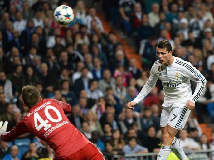 MADRID, SPAIN - MARCH 10: Ronaldo (R) of Real Madrid in action against Timon Wellenreuther (L) of Schalke as he shoots during the UEFA Champions League round of 16 second leg match between Real Madrid CF and FC Schalke 04 at Estadio Santiago Bernabeu on March 10, 2015 in Madrid, Spain.