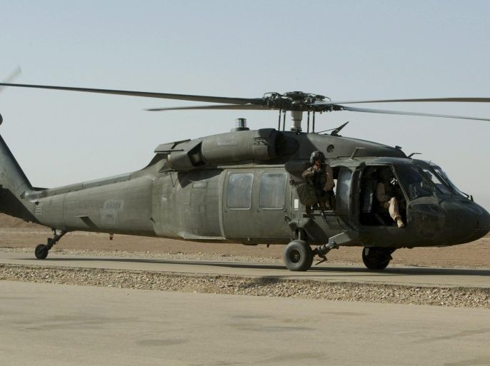 (FILE) A file photo dated 15 September 2003 showing a US Black Hawk helicopter preparing to take off in Baghdad, Iraq. Reports on 11 March 2015 state a US Army National Guard UH-60 Black Hawk helicopter with 11 people onboard crashed during a practice flight at Eglin Air Force Base in Florida, USA. The team onboard the helicopter consisted of four crew members and seven marines. There are no reports yet of injured or casualties but authorites state they have located the debris of the helicopter. EPA/ALI HAIDER *** Local Caption *** 01509815
