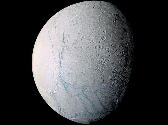 This June 28, 2009 image provided by NASA, taken by the international Cassini spacecraft, shows Enceladus, one of Saturn’s moons. A new study published online Wednesday, March 11, 2015, in the journal Nature, suggests there are ongoing interactions between hot water and rocks beneath the surface of the icy moon. (AP Photo/NASA)