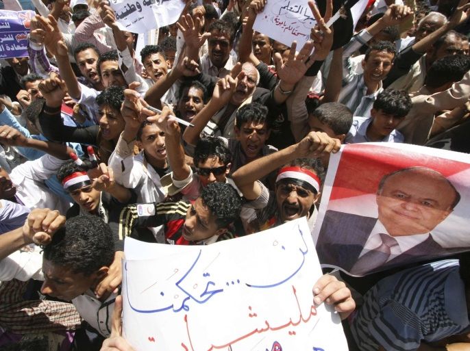 Anti-Houthi protesters shout slogans during a demonstration to show support to Yemen's President Abd-Rabbu Mansour Hadi in the southwestern city of Taiz March 4, 2015. The sign (front) reads: "We will not be ruled by a militia." REUTERS/Anees Mahyoub (YEMEN - Tags: CIVIL UNREST POLITICS MILITARY)