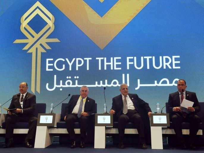 Egypt's Finance Minister Hany Dimian (L-R), central bank governor Hisham Ramez, Prime Minister Ibrahim Mehleb and Planning Minister Ashraf al-Arabi attend the Egypt Economic Development Conference (EEDC) in Sharm el-Sheikh, in the South Sinai governorate, south of Cairo, March 14, 2015. Gulf Arab allies pledged a further $12 billion of investments and central bank deposits for Egypt at an international summit on Friday, a big boost to President Abdel Fattah al-Sisi as he tries to reform the economy after years of political upheaval. REUTERS/Amr Abdallah Dalsh (EGYPT - Tags: BUSINESS POLITICS)