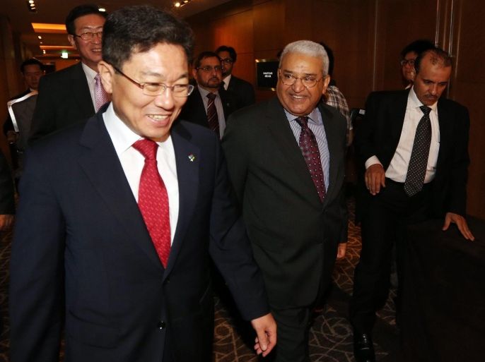 South Korea's Energy Minister Yoon Sang-jick (L) and Hashim Yamani (C), the head of Saudi Arabia's K.A. CARE (King Abdullah City for Atomic and Renewable Energy), walk together to attend a roundtable meeting on nuclear power cooperation in Seoul, South Korea, 24 June 2013. South Korea is hoping to participate in Saudi Arabia's project to build up to 16 nuclear reactors by 2032. EPA/YONHAP SOUTH KOREA OUT