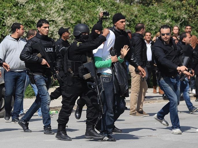 TUNIS, TUNISIA - MARCH 18: Police forces arrest a suspicious man when gunmen take an unknown number of tourists hostage at the National Bardo Museum, near the country's parliament in Tunis, on Wednesday, March 18, 2015.