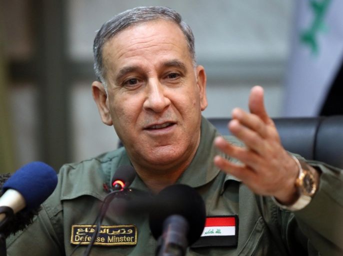 Iraqi Defence Minister Khaled al-Obeidi gestures during a press briefing with members of the foreign media on March 18, 2015, in Baghdad. Iraq's offensive to retake Tikrit from the Islamic State group was stalled this week because of streets and buildings rigged with booby trap bombs and by the several hundred jihadists still holding out there as well as to avoid casualties and to protect infrastructure, Iraqi officials have said. AFP PHOTO/ ALI AL-SAADI
