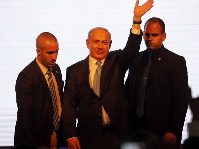 Israeli Prime Minister Benjamin Netanyahu waves to supporters as he delivers his speech in Tel Aviv, Israel, 17 March 2015. First exit polls suggest the parliamentary election is too close to call yet. Preliminary results are expected by 18 March and final results by 25 March.