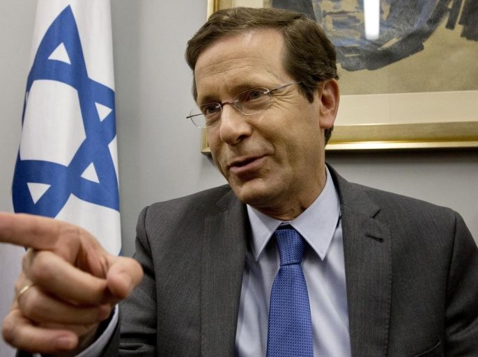 FILE - In a Monday, March 16, 2015 file photo, Israeli leader of the center-left Zionist Union Isaac Herzog speaks with Israeli voters persuading them to vote for him in the upcoming Israeli elections in his party headquarters in Tel Aviv, Israel, a day ahead of legislative elections. Israel's election has yielded a fractured parliament and no clear winner, setting up a horse-trading phase that seems likely to leave Prime Minister Benjamin Netanyahu in his post and place the country on the brink of confrontation with the world. It could also force a joint government with moderate challenger Isaac Herzog. And there is the slimmest of chances that Herzog, through machinations, ends up on top. Everything is in the hands of Moshe Kahlon, a relative newcomer to the big leagues of Israeli politics. (AP Photo/Ariel Schalit, File)