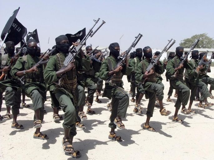 CORRECTS AMOUNT KILLED TO 173: FILE - In this Thursday, Feb. 17, 2011 file photo, hundreds of newly trained al-Shabab fighters perform military exercises in the Lafofe area some 18 km south of Mogadishu, in Somalia. Kenya's police force said Wednesday, Feb. 25, 2015 that 173 people were killed in 2014 in attacks by Islamic extremists, the highest number in the three years that Kenya has experienced violence blamed on neighboring Somalia's al-Shabab militants. (AP Photo/Farah Abdi Warsameh, File)