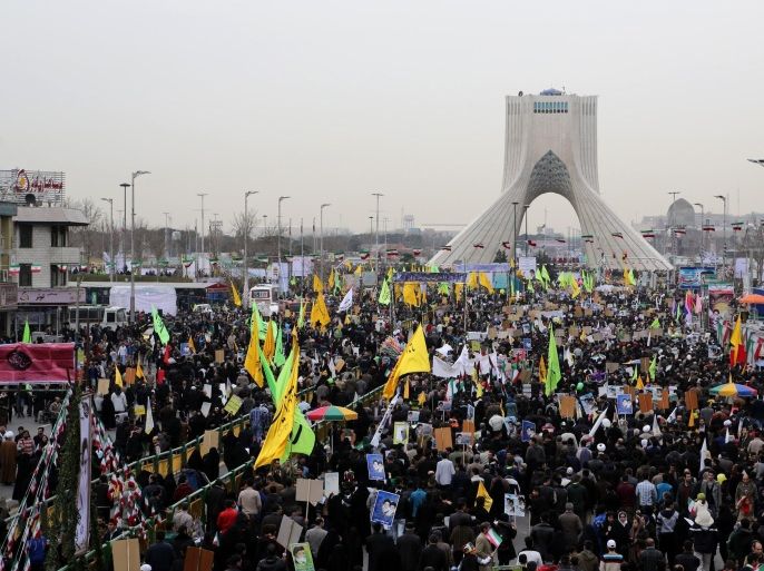 Iranians gather in Tehran's Azadi Square (Freedom Square) for a rally to mark the 36th anniversary of the Islamic revolution on February 11, 2015. Iranians gathered in cities and villages all over the country to mark the 36th anniversary of the revolution which transformed the country from a US-backed monarchy into a cleric-ruled republic. AFP PHOTO / ATTA KENARE