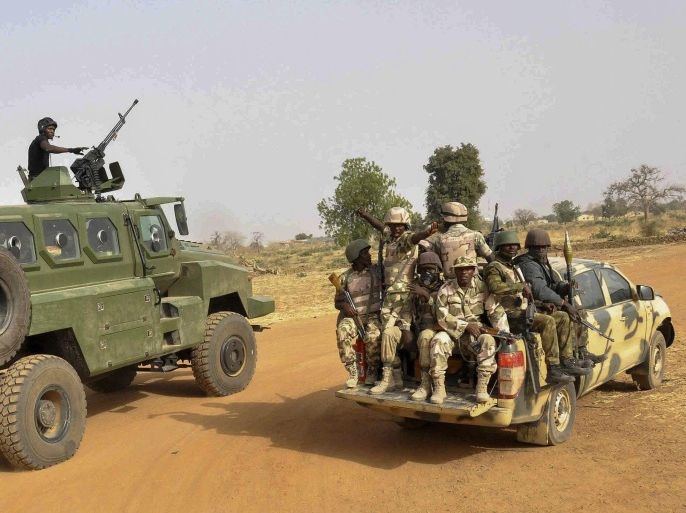 A photograph made available 08 March 2015 shows the Nigerian army patroling in Chibok, Borno State, North Eastern Nigeria 05 March 2015. According to reports two busy markets and a bus station wre the targets of an alleged Boko Haram suicide attack which killed 54 people and injured 143 in the city of Maiduguri in north-eastern Nigeria 07 March 2015.
