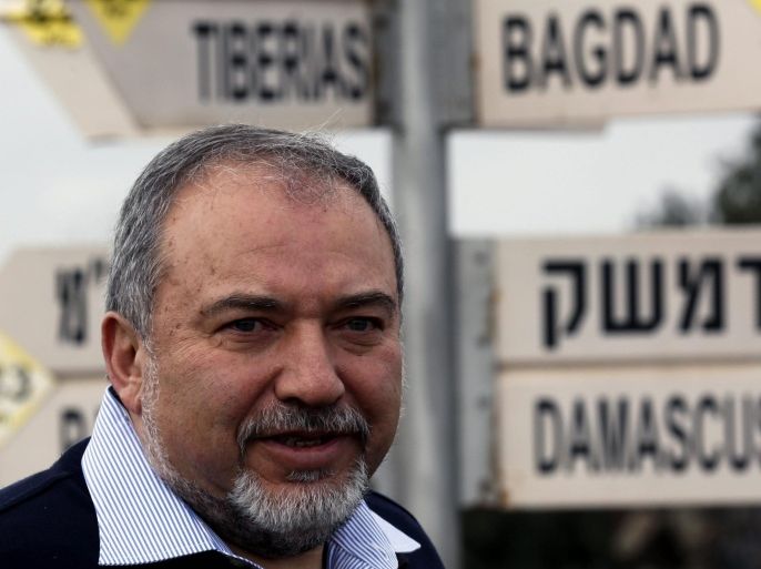 Israeli Foreign Minister Avigdor Liberman stands in front of a road sign showing the distace to Syrian capital Damascus at Merom Golan lookout position on the Golan Heights, next to the Syrian border, 30 January 2015. Lieberman said during a meeting with his Party activists that the Israeli reactions for the attack on the northern border will encourage Hezbollah to carry additional attacks in the Lebanon and the Syrian front.