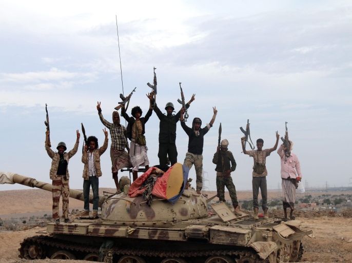 Tribal militiamen loyal to Yemeni President Abdo Rabbo Mansour Hadi stand on a tank positioned in the southern city of Lahj, Yemen, 23 March 2015. Reports state that tribal militiamen loyal to Yemeni President Hadi are deployed around the city of Lahj, along the border with Taiz city which was captured one day ago by Shiite Houthi rebels. Houthi leader Abdul-Malik al-Houthi has called on his supporters to mobilise towards the south of Yemen. EPA/STR