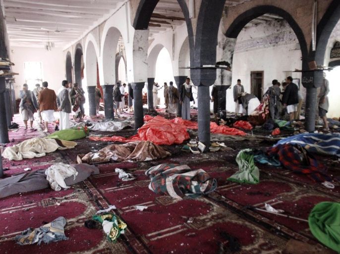 Bodies of people killed in a suicide attack during the noon prayer are covered in blankets in a mosque in Sanaa, Yemen, Friday, March 20, 2015. Triple suicide bombers hit a pair of mosques crowded with worshippers in the Yemeni capital, Sanaa, on Friday, causing heavy casualties, according to witnesses. The attackers targeted mosques frequented by Shiite rebels, who have controlled the capital since September. (AP Photo/Hani Mohammed)