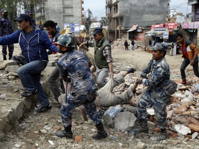 Members of a rescue team collect dead bodies from the rubble of collapsed buildings during early morning a day after a massive earthquake, in Kathmamdu, Nepal, 26 April 2015. More than 1,800 people were confirmed dead and many more were feared trapped under rubble on 25 April in Nepal's worst earthquake in more than 80 years. The official death toll from the magnitude-7.9 earthquake reached 1,805, the Home Ministry said. One official said that figure could triple. Saturday's quake flattened buildings across the country and razed many historic landmarks. It was also felt in China, Bangladesh and India, where more than 40 deaths were reported. Buildings in the ancient centre of Kathmandu were destroyed, leaving mounds of timber and rubble, local television reported.  EPA/NARENDRA SHRESTHA
