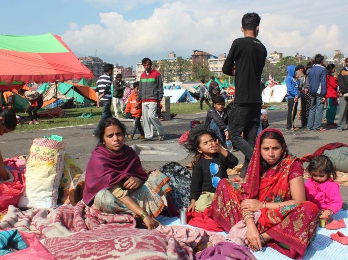 A picture made available on 28 April 2015 shows residents staying in an open area in Kathmandu, Nepal, 27 April 2015, to keep safe amid continuing aftershocks following the magnitude-7.8 earthquake that struck Nepal on 25 April. Nepal's government declared three days of mourning on 28 April, for the more than 4,000 people who died in a massive earthquake at the weekend. The government raised the death toll to 4,353 as the volunteers searched for dead and missing.  EPA/YONHAP SOUTH KOREA OUT