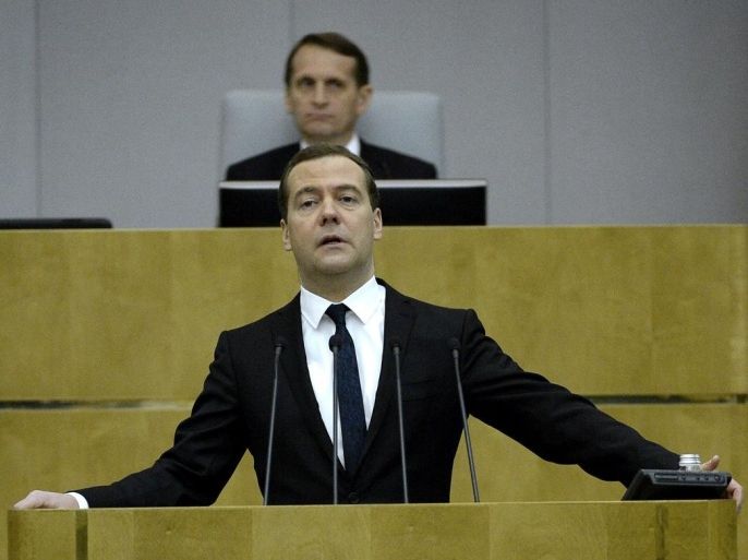 Russian Prime Minister Dmitry Medvedev speaks in the lower house of Russia's parliament, the State Duma, in Moscow on April 21, 2015. Dmitry Medvedev on April 21 estimated the economy shrank by two percent in the first three months of the year, due to sanctions pressure and low oil prices. AFP PHOTO / YURI KADOBNOV