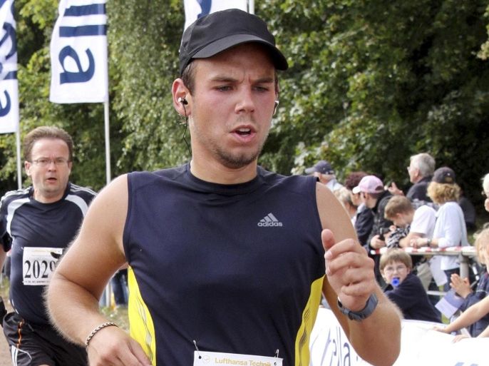 FILE - In this Sunday, Sept. 13, 2009 photo, Andreas Lubitz competes at the Airportrun in Hamburg, Germany. Investigators believe the 27-year-old Germanwings co-pilot locked his captain out of the cockpit during a March 24, 2015 flight from Barcelona to Duesseldorf and deliberately put the plane into its fatal descent into a French mountainside. (AP Photo/Michael Mueller)