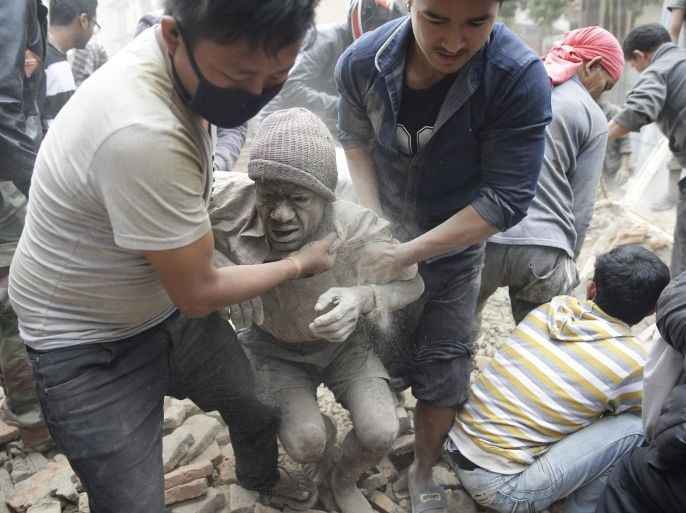 People free a man from the rubble of a destroyed building after an earthquake hit Nepal, in Kathmandu, Nepal, 25 April 2015. A 7.9-magnitude earthquake rocked Nepal destroying buildings in Kathmandu and surrounding areas, with unconfirmed rumours of casualties. The epicentre was 80 kilometres north-west of Kathmandu, United States Geological Survey. Strong tremors were also felt in large areas of northern and eastern India and Bangladesh.