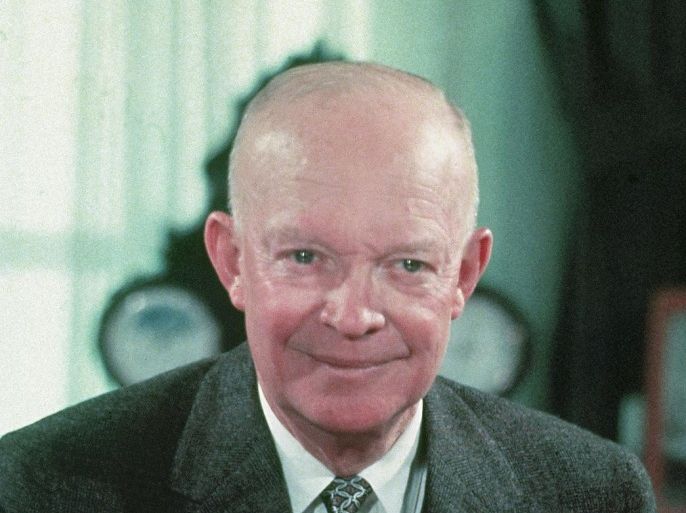 FILE - In this 1956 file photo, President Dwight Eisenhower is seen at his desk at the White House in Washington. The future of a planned memorial honoring President Dwight D. Eisenhower was thrown into doubt Tuesday as lawmakers questioned the project's design and cost and Ike's family called again for the memorial project to be redesigned. A House panel hosted a hearing on the 14-year-old project, which has secured a site for the memorial at the foot of Capitol Hill near the National Air and Space Museum. Planners could lose that space, though, without an extension soon from Congress.
