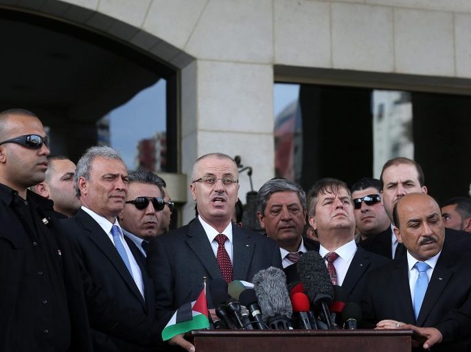 Palestinian Prime Minister Rami Hamdallah (C), speaks to the Palestinian media during his visit in the northern Gaza Strip, 25 March 2015. Reports state that Palestinian Prime minister Dr. Rami AL- Hamdallah visit Gaza for the first time since 09 October 2014.