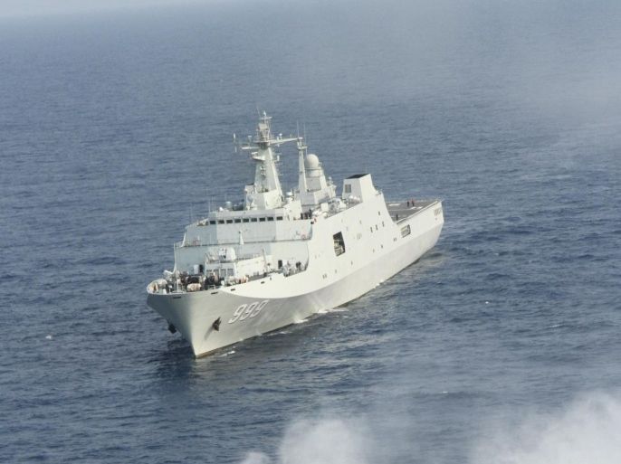 In this photo taken on Wednesday, March 20, 2013 released by China's Xinhua News Agency, China's amphibious ship Jinggangshan is seen during a coordination training with a hovercraft in waters near south China's Hainan Province, in the South China Sea. China s increasingly powerful navy paid a symbolic visit to the country s southernmost territorial claim deep in the South China Sea this week as part of military drills in the disputed Spratly Islands involving amphibious landings and aircraft. Sailors joined in the ceremony Tuesday, March 26 aboard Jinggangshan at James Shoal, a collection of submerged rocks, located 80 kilometers (50 miles) off the coast of Malaysia and about 1,800 kilometers (1,120 miles) from the Chinese mainland, the official Xinhua News Agency reported.