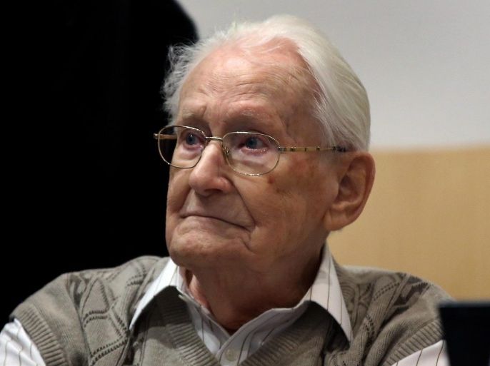 Defendant Oskar Groening takes his seat in the courtroom in Lueneburg, Germany, 21 April 2015. More than 70 years after the liberation of Auschwitz, former SS member Oskar Groening, 93, is going on trial, accused of being an accessory to 300,000 murders. For survivors and their families, the case is about justice, not a possible sentence. A larger trial venue, the Ritterakademie, has been especially rented out to accommodate journalists. There will be 60 seats reserved for the media, including 23 for foreign journalists.