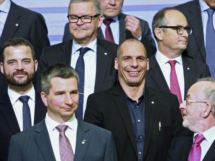 Greek Finance Minister Yanis Varoufakis, center, poses for a photo with other participants at the Informal Meeting of Ministers for Economic and Financial Affairs of the European Union in Riga, Latvia on Friday, April 24, 2015. Greece's finance minister came under fire Friday from his peers in the 19-country eurozone for failing to come up with a comprehensive list of economic reforms that are needed if the country is to get vital loans to avoid going bankrupt. (Dmitris Sulzics/F64 Photo Agency via AP)