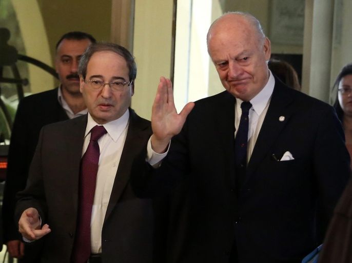 UN peace envoy to Syria Staffan de Mistura (R) gestures as he walks with Syrian Deputy-Foreign Minister Faisal Mekdad (L), after returning to his residence at Sheraton hotel in Damascus, Syria, 11 February 2015. De Mistura is on an official visit to Syria to push ahead with his initiative to freeze fighting in the northern city of Aleppo. He met a day earlier with Syrian Foreign Minister Walid al-Moallem.